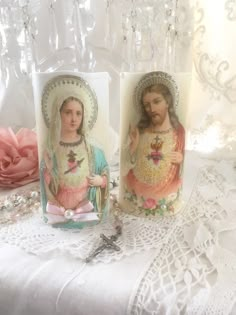 "Beautiful pair of Victorian inspired Jesus and Mary flameless candles adorned with sparkling German glass glitter, pearl adornments and pink satin bows. The pastel coloring is perfect for shabby cottage chic style decorating! That's adorable pair would look lovely displayed on a mantle, alter, shrine or makes a sweet devotional gift. Made of white wax...The lightweight candles have a realistic shaped design at the top, these are really good quality. Battery operated candles are a safe alternati Catholic Core, Jesus Aesthetic, Church Aesthetic, Jesus And Mary, German Glass Glitter, Catholic Crafts, Burning Candles, Spring Tea, Glass Glitter