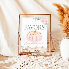 there is a sign that says favors please to me and a vase with flowers in it