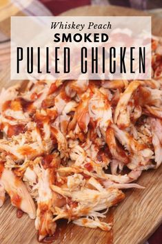 pulled chicken on a cutting board with text overlay that reads whiskey peach smoked pulled chicken