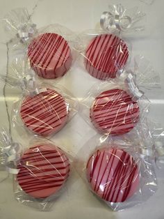 four heart shaped candys wrapped in plastic