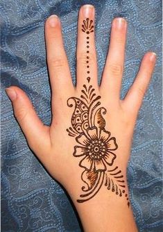 a hand with a henna tattoo on it's palm and the words, so beautiful back of the hand henna tattoo designs / styles