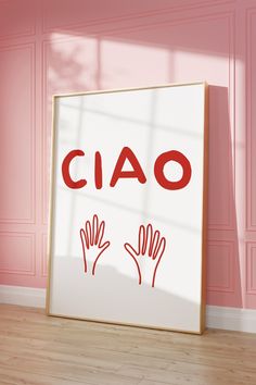 a sign that says ciao on it in front of a pink wall and wooden floor