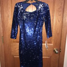 Vibrant Blue Sequined Cocktail Dress. Size 3. New With Tags. Interesting Open Back With Flattering Ruching Details. Holiday Party? Winter Formal? New Year’s Eve? Blue Sequin Dress For Holiday Party, Blue Sequined Dresses For Holiday Party, Blue Long Sleeve Mini Dress For Holiday, Blue Knee-length Mini Dress With Sequins, Fitted Blue Mini Dress For Holiday, Blue Mini Dress For Holiday, Blue Mini Dress For Holidays, Blue Mini Holiday Dresses, Holiday Blue Mini Dresses