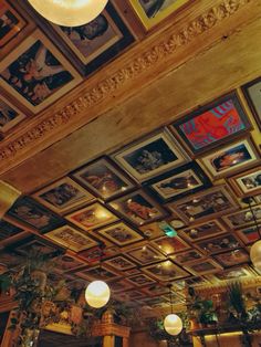 the ceiling is decorated with paintings and lights