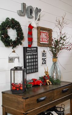 a table with christmas decorations on it and other items sitting on top of the table