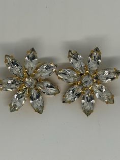 Vintage 1970's High End Clip on earrings Claw set  new old stock Flower Diamante with gold  Clip on earrings never been worn  1.5 inch x 1.5 inch  Each Earring weight in 9.2 grams Vintage Earrings Gold, Vintage Gold Earrings, Stock Flower, Gold Clips, Flower Clip, Vintage Earrings, Earrings Gold, Clip On, Clip On Earrings