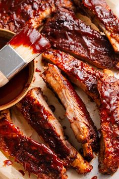 bbq ribs with barbecue sauce in a wooden bowl