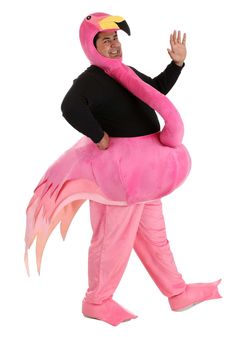 a man in a pink flamingo costume is walking with his hand up to the side