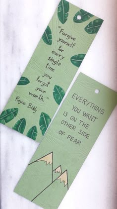 two bookmarks with green leaves on them, one has a quote and the other says everything you want is on the other side of fear