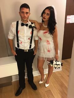 a man and woman dressed up as zombies