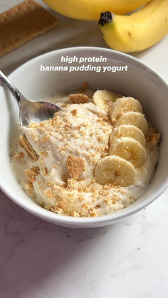 a bowl filled with cereal and bananas on top of a table