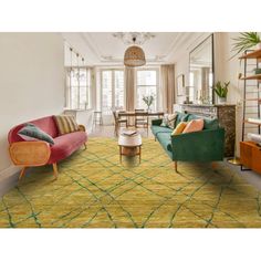 a living room filled with lots of furniture and decor on top of a green rug