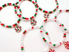 Here are the Christmas bracelets coming! Those bracelet are made by simple way, red, green, pearl white and glass white are the main colors. I add candy pendant on the bracelets to make them look cuter and joyful.  You can choose a single bracelet, or a set (can be with ring too). I also do personalization, you can simply give me a name or word or number, such as: Happy. Material: Glass beads, alloy pendant Size:  Bracelet: 14cm, 15cm, 16cm, 17cm, 18cm Ring: size 6, 7, 8, 9, 10 Heishi Bracelets, Bracelets To Make, Holiday Bracelets, Single Bracelet, Bracelet Christmas, Christmas Bead, Christmas Bracelet, Christmas Jewelry, Pendant Bracelet