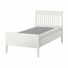 a white bed frame with no mattress on it