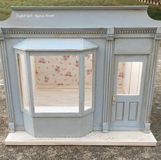 a doll house made out of an old cabinet