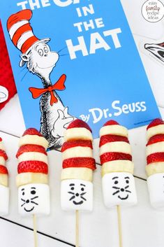 the cat in the hat lollipops are lined up with marshmallows