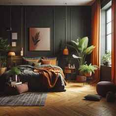 a bedroom with black walls, wooden floors and lots of greenery in the corner