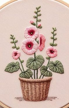 a basket with pink flowers in it sitting on a table