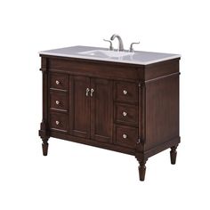 a bathroom sink sitting under a wooden cabinet