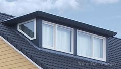 the roof of a house with three windows