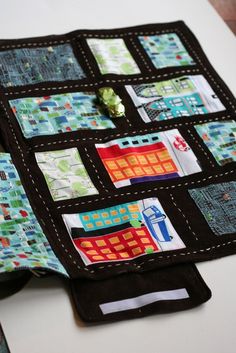 a close up of a quilted table runner on top of a white table cloth