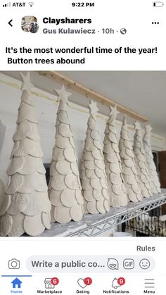 a group of white ceramic trees sitting on top of a shelf