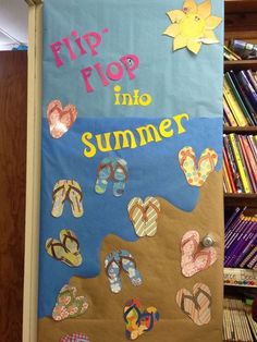 a bulletin board with flip flops and sandals on it in front of a bookshelf