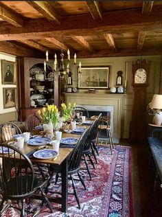 the dining room table is set with plates and place settings for eight people to eat