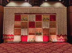 the stage is decorated with red and white curtains