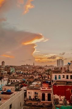 the sky is very cloudy over some buildings