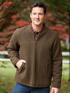 This casual coat features the thermoregulating benefits of wool - keeping you feeling just right - and enhanced durability from polyester. Other details include a comfortable quilted lining, soft rib-knit stand-up collar, and adjustable snap cuffs to keep the chill out. A generously sized inside security pocket and two side-entry pockets with snap closures keep essentials safe and at hand. Wool coat with a durable polyester quilted lining Rib-knit stand-up collar Adjustable snap cuffs 6" inside Long Sleeve Sport Coat For Travel In Fall, Classic Wool Sport Coat For Outdoor, Classic Quilted Jacket For Winter Outdoor, Classic Outerwear With Fleece Lining For Cold Weather, Brown Wool Outerwear For Outdoor, Classic Solid Color Outerwear For Travel, Classic Solid Color Travel Outerwear, Classic Travel Outerwear In Solid Color, Twill Coat