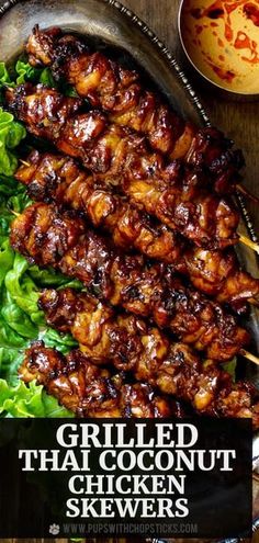 grilled thai chicken skewers with lettuce and sauce on the side