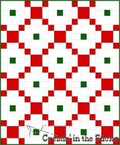 a red and green quilt with squares in the center, on top of it is an image