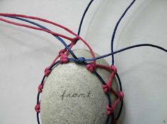 a white ball with red and blue string wrapped around it