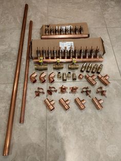 copper pipes and fittings laid out on the floor