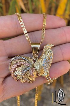 This 14K gold-filled chicken rooster necklace is adorned with sparkling CZ stones. Its intricate design captures the essence of courage and confidence, making it a unique and eye-catching accessory. PRODUCT DETAILS * Material: 14K Gold Filled * Metal Purity: 14K * Chain Size: 24" Inches * Pendant Size: 33x45mm * Chain Thickness: 3mm * Jewelry Type: Necklace * Stone Type: Cubic Zirconia * Stone Shape: Round * Gender: Male * Age Group: Adults * Condition: 100% BRAND NEW SHIPPING DETALS * Fast & Fr Newark Nj, Figaro Chain, Figaro Chains, Cz Stone, Stone Necklace, Pendant Necklaces, Favorite Jewelry, Rooster, Gold Filled