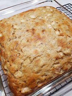 a square cake sitting on top of a cooling rack