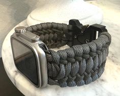 Custom Made paracord watchband for Apple Watch. Using a Tactical Buckle. If Watch or Wrist Size is sold out, please message me for special order *Watch not included Adjustable Paracord Watch Bands For Outdoor, Black Paracord Watch Accessories For Outdoor, Durable Adjustable Watch Bands For Outdoor, Outdoor Black Paracord Watch Accessories, Durable Adjustable Outdoor Watch Bands, Durable Silver Watch Bands For Outdoor, Silver Durable Watch Bands For Outdoor, Outdoor Durable Silver Watch Bands, Paracord Watchband