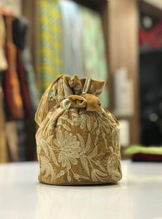 Complete your traditional looks with this lovely potli bag on your wrist, which is trendy yet compact enough to carry your essentials in style. This potli bag will be a pretty inclusion in your accessory collection and perfect for taking in a party.This bag can also be used as a wedding favour bag. It is perfect as a gift for weddings, bridal showers, baby showers, wedding receptions - excellent to fill with candy, dry fruits, sweets, herbs, soap, something remarkable for your guests that no one Indian Magic, Vintage Style Bag, Magic Bag, Vintage Wedding Gifts, Potli Bag, Pashmina Wrap, Ethnic Bag, Potli Bags, Dry Fruits