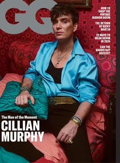 the cover of gq magazine features a man in blue shirt and black pants sitting on a red couch