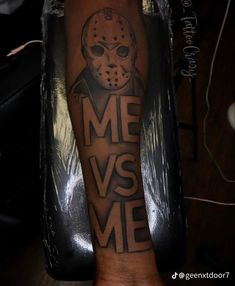 a person with a tattoo on their arm that says me vs me and a hockey mask