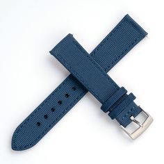 Crafted from durable sailcloth canvas with a leather underside, it is the ideal choice for outdoor enthusiasts or anyone looking for a strap that can withstand the rigors of daily wear. The leather ensures optimal comfort with its smooth texture and soft feel against the skin. Installation is easy thanks to the built-in quick release spring bars. While it may be stiff initially, it should break-in for a snug fit after just a few wears. Color: Blue with color matched stitchingMaterial: Sailcloth Casual Leather Watch Accessories For Outdoor, Blue Watch Accessories With Leather Strap, Casual Leather Watch Accessories For Everyday Use, Adjustable Blue Leather Watch Band, Leather Watch Bands For Outdoor, Blue Watch Accessories With Adjustable Leather Strap, Adjustable Leather Watch Bands For Outdoor, Blue Leather Strap Watch Band For Everyday Use, Blue Adjustable Leather Strap For Watch