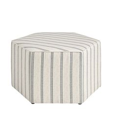 a striped ottoman sits on top of a white surface with black legs and an upholstered foot rest