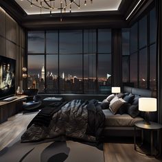 a bedroom with large windows and a view of the city at night in the distance