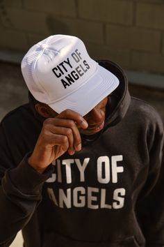 Our foam trucker hat is the perfect City of Angels staple. Vented mesh side panels allow for breathability + an interior sweatband makes it functional + comfortable even on the hottest days. Adjust the strap on the back to find your perfect fit. - High density puff print - Mesh details - Adjustable snap back closure Puff Print, City Of Angels, Outfits With Hats, Snap Back, Snap Backs, Hot Days, Side Panels, Trucker Cap, Panel Siding