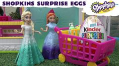 two dolls are standing next to a shopping cart with eggs in it and the words shopkinss surprise eggs