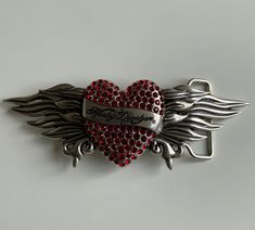 This beautiful buckle is designed to fit an 1.5" (38mm) belt strap. Solidly cast ,sculpted and finely detailed featuring a Rhinestone heart  with wings and inlaid red rhinestones. The buckle is plaited in a thick , rich coating of polished silver plaiting. This is a stunning and beautiful buckle. 2000s Mcbling, Heart Wings, 2000 Fashion, Heart With Wings, Harley Davidson Women, Thrift Finds, Year 2000, Rhinestone Heart, Red Rhinestone