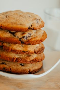 a stack of cookies sitting on top of a white plate