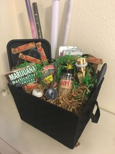 a black basket filled with lots of different items