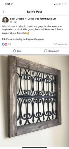 an old window frame that has been made into a wall hanging on the side of a wall